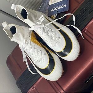 Stylish White and Black and gold cleats